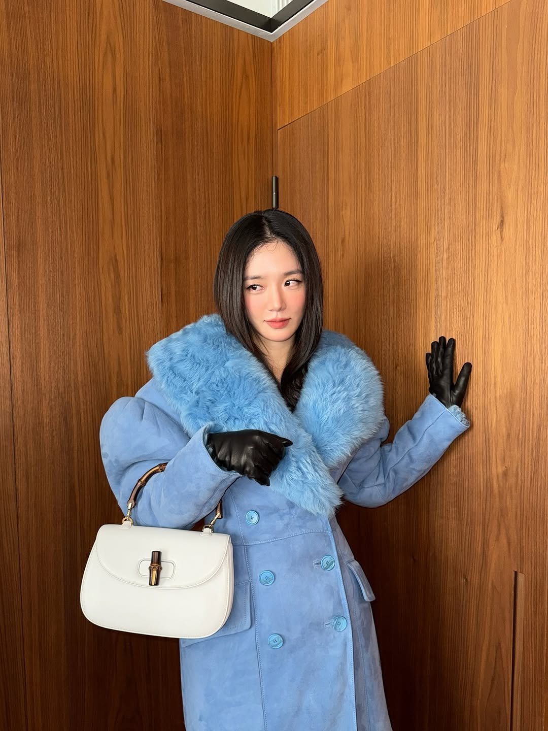 Photo shared by 박규영 on September 23, 2025 tagging @gucci, and @demna. May be an image of 1 person, duffle coat, overcoat, sable coat, goosedown coat, parka, jacket, purse and text.