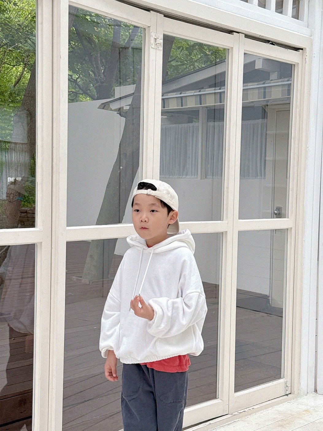Photo by Lazy Day Routine on September 21, 2025. May be an image of 1 person, child, duffle coat, raincoat, cloak and text.