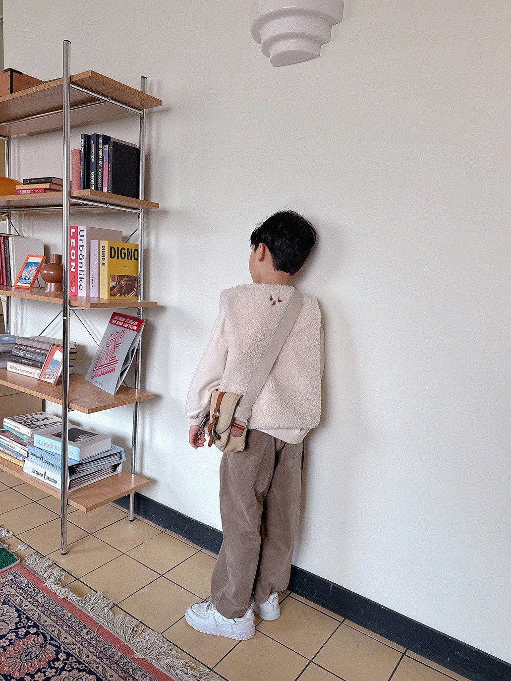 Photo by Lazy Day Routine on October 30, 2025. May be an image of duffle coat, cardigan, sweater, wool, rack, knit, shelf and text.