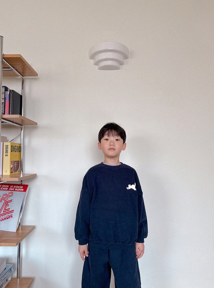 Photo by Lazy Day Routine on November 06, 2025. May be an image of standing, duffle coat, sweatpants and text.