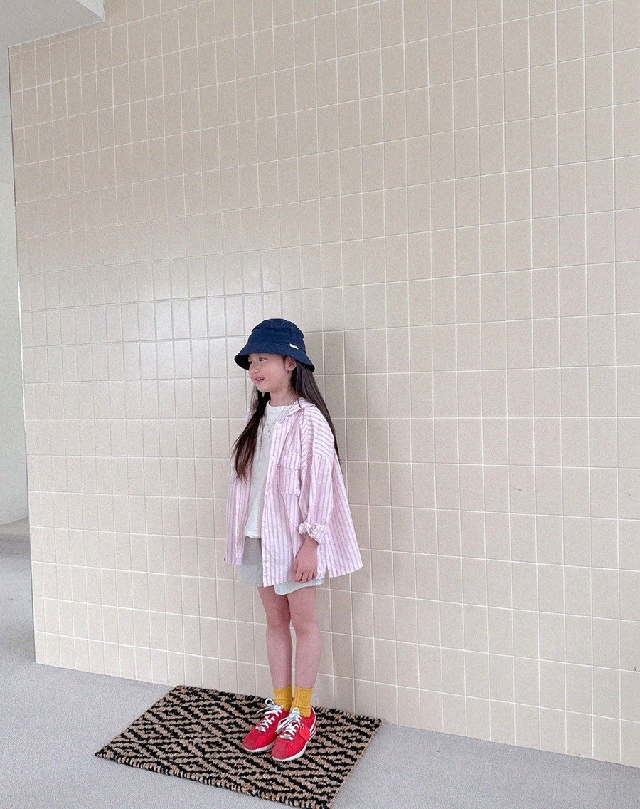 Photo by Lazy Day Routine on June 16, 2025. May be an image of 1 person, child, shorts, beret and text.
