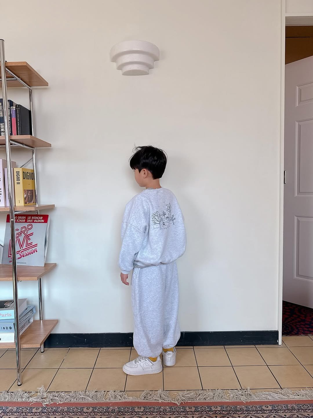 Photo by Lazy Day Routine on November 03, 2025. May be an image of standing, sleepwear, bath robe, snowsuit, sweatsuit, sweatpants and text.