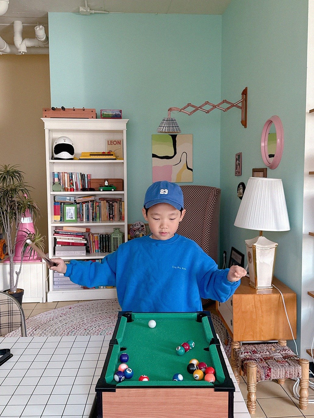 Photo by Lazy Day Routine on October 30, 2025. May be an image of child, billiards and text.