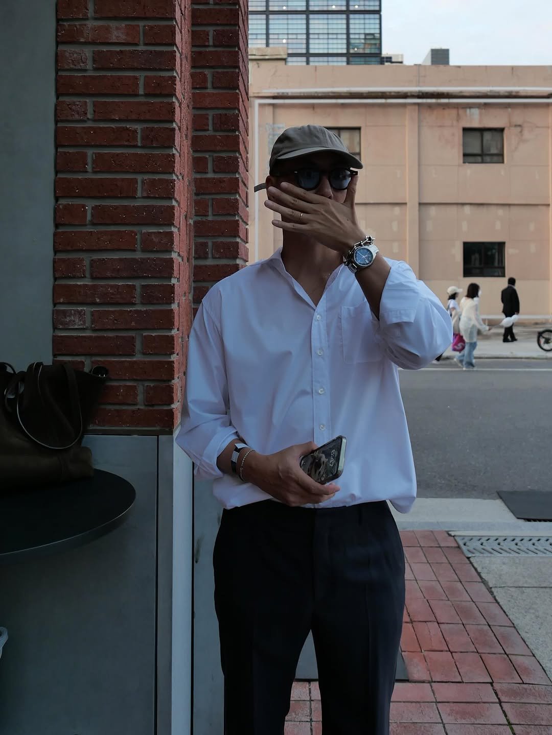 Photo shared by 런업 ランアプ on September 06, 2025 tagging @gloriousworker. May be an image of 3 people, people smoking, phone, wingtip shoes, cigarette, suit, cornflower, street and text.