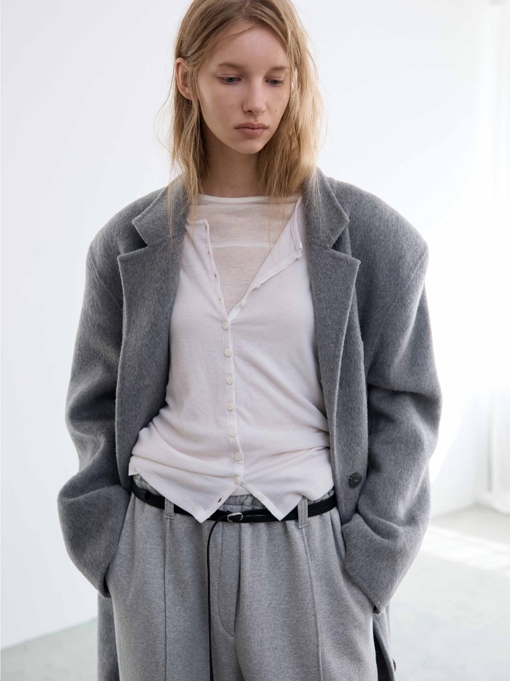 Photo by LECLE on November 13, 2025. May be an image of overcoat, cardigan and text.