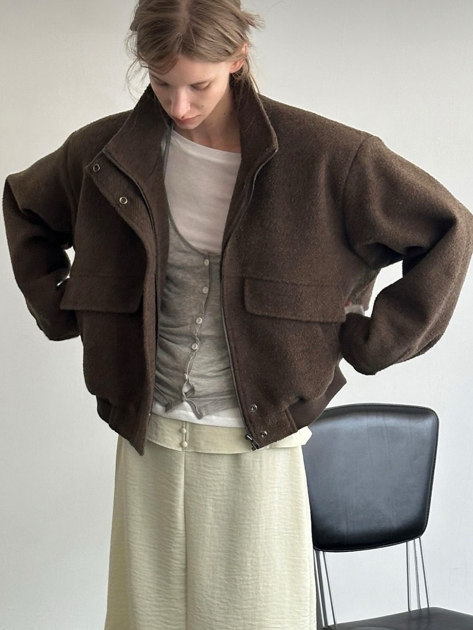 Photo by LECLE on October 30, 2025. May be an image of duffle coat, overcoat, jacket, cardigan, wool and text.