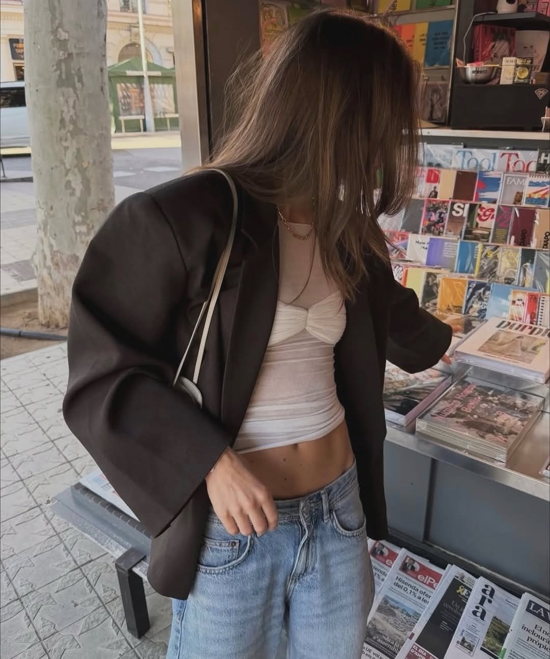 Photo by 이해리 on March 02, 2026. May be an image of overcoat, newspaper, blazer, jacket, top, newsstand and text.