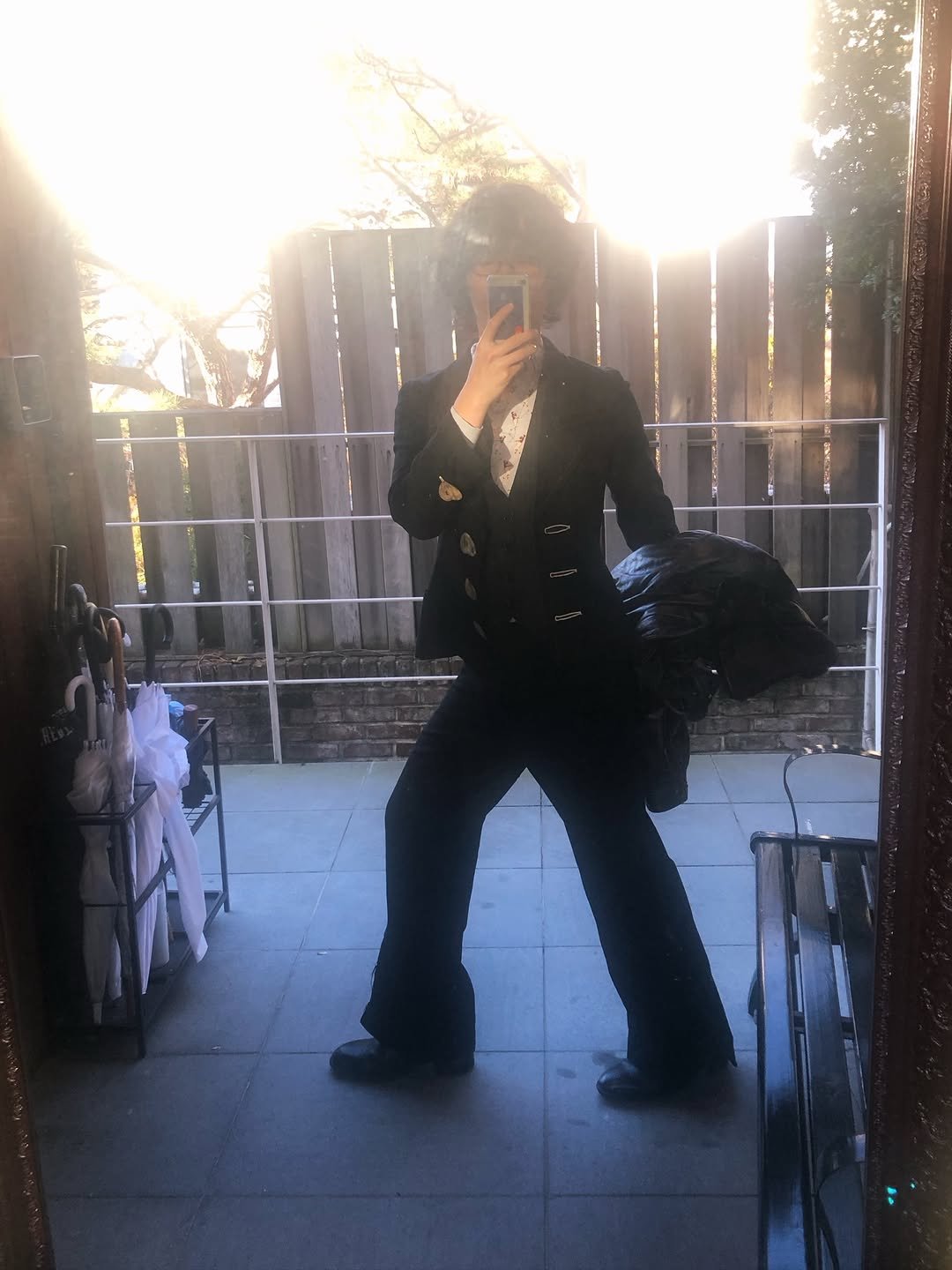 Photo by 이찬혁 on December 31, 2025. May be an image of pants, overcoat, wingtip shoes, bowler hat, glasses, blazer and text.