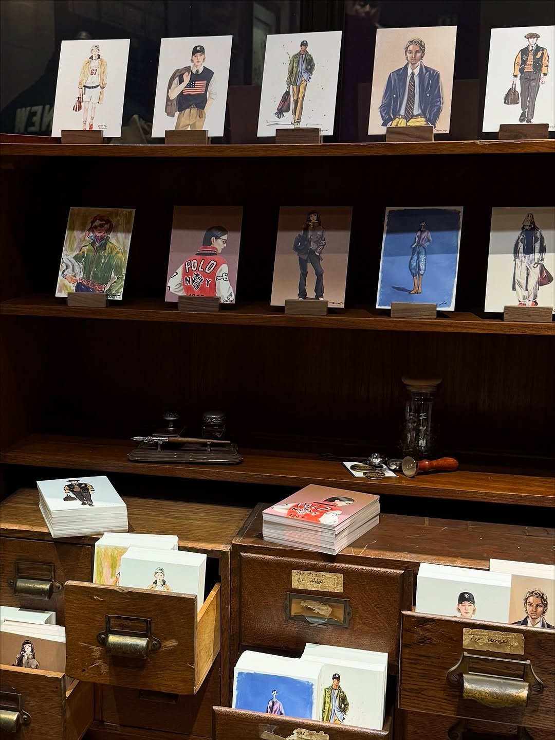 Photo by 리곡 on October 15, 2025. May be an image of matchbook, rack, shelf, book, card, newsstand and text.