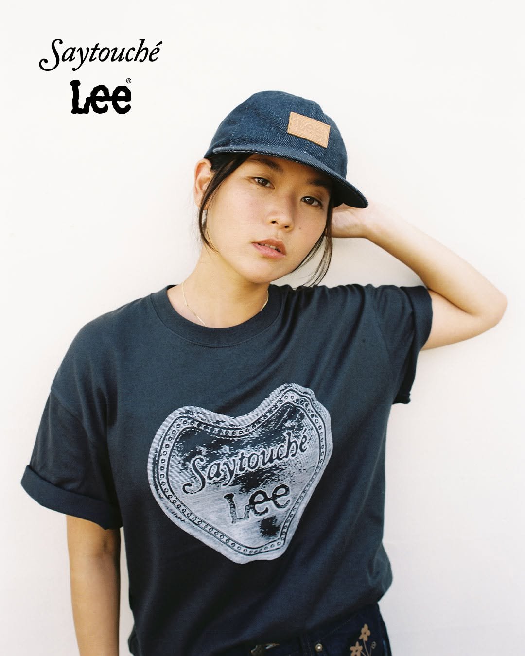 Photo shared by Lee Jeans KOREA on September 03, 2025 tagging @say_touche. May be an image of 1 person, hat, top and text that says 'Saytouché Lee Saytordhe Lee'.