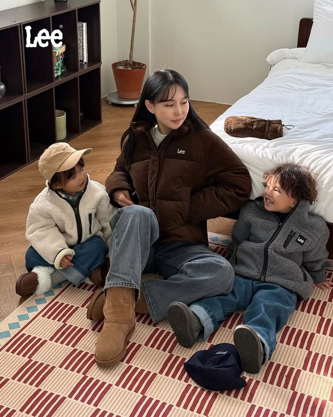 Photo shared by Lee Jeans KOREA on November 30, 2025 tagging @leekidskr. May be an image of child, goosedown coat, duffle coat, mattress, fleece and text.