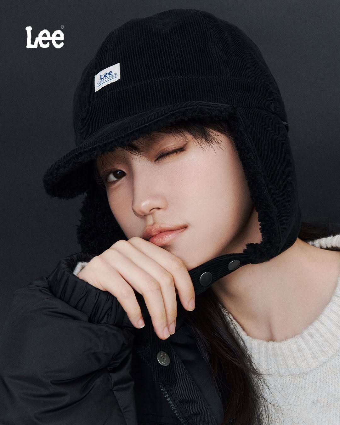 Photo shared by Lee Jeans KOREA on October 22, 2025 tagging @rohyoonseo. May be an image of duffle coat, hat, beret, face mask, parka and text.