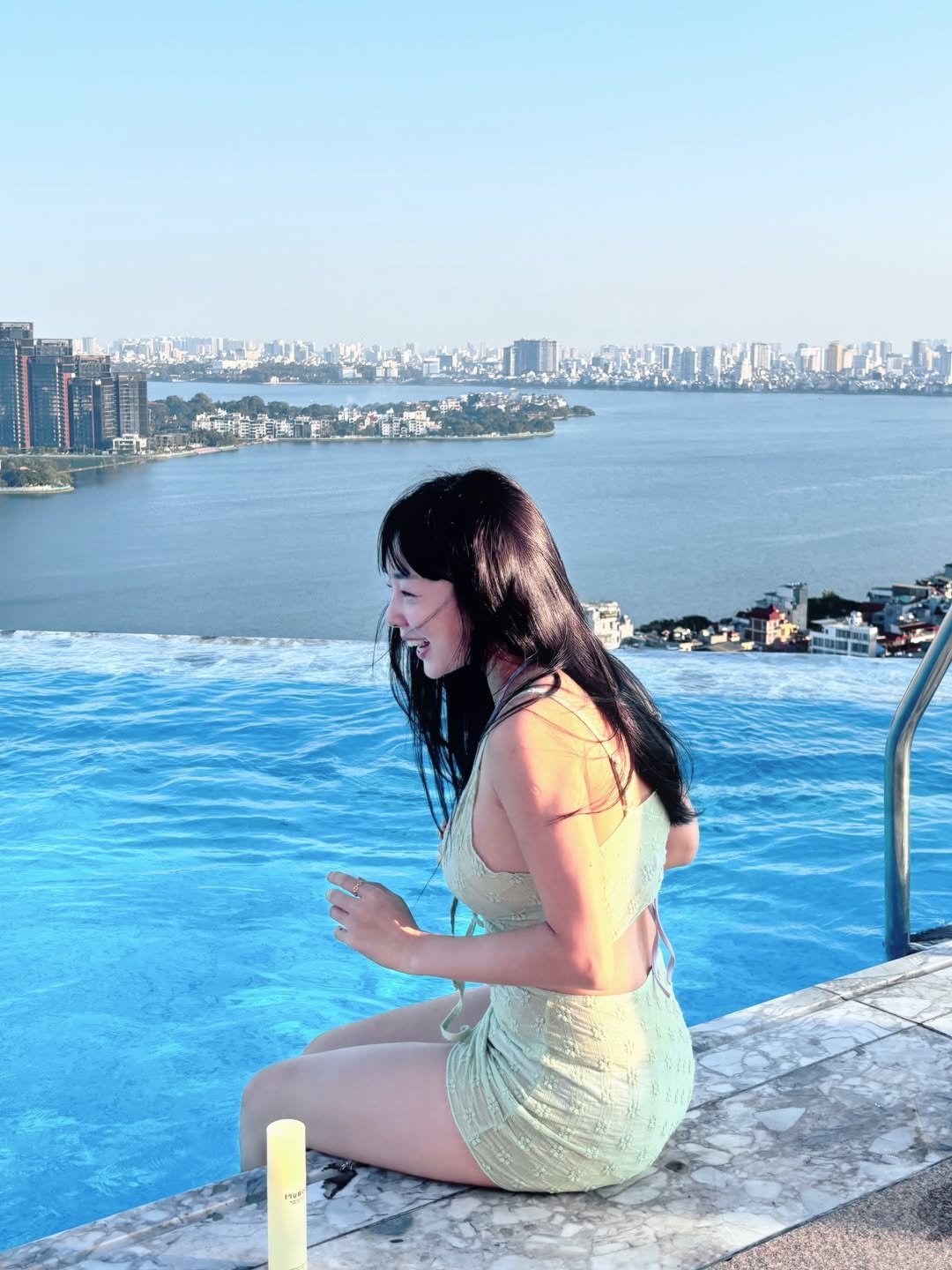 Photo shared by 이유데이 on August 17, 2025 tagging @yoobohwa, and @leeyooday. May be an image of 1 person, Victoria Peak, horizon, pool and text.