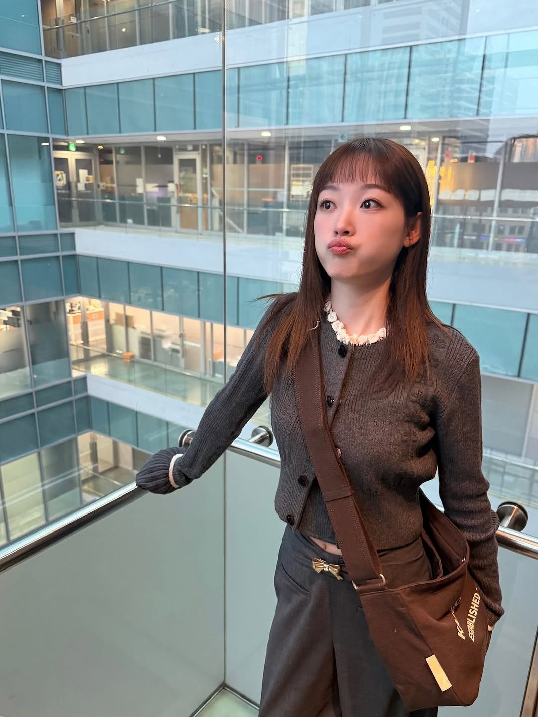 Photo by 이유미 on October 30, 2025. May be an image of one or more people, hair, duffle coat, suit, blazer, turtleneck and text.