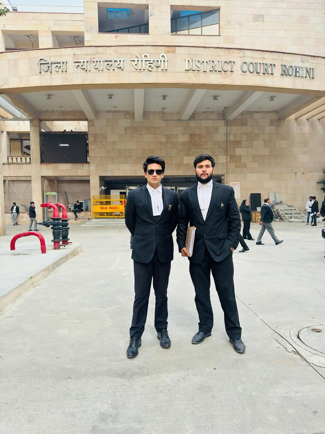 Photo by Utsav Shukla in Rohini Courts Delhi. May be an image of one or more people, people standing, suit, dinner jacket and text.