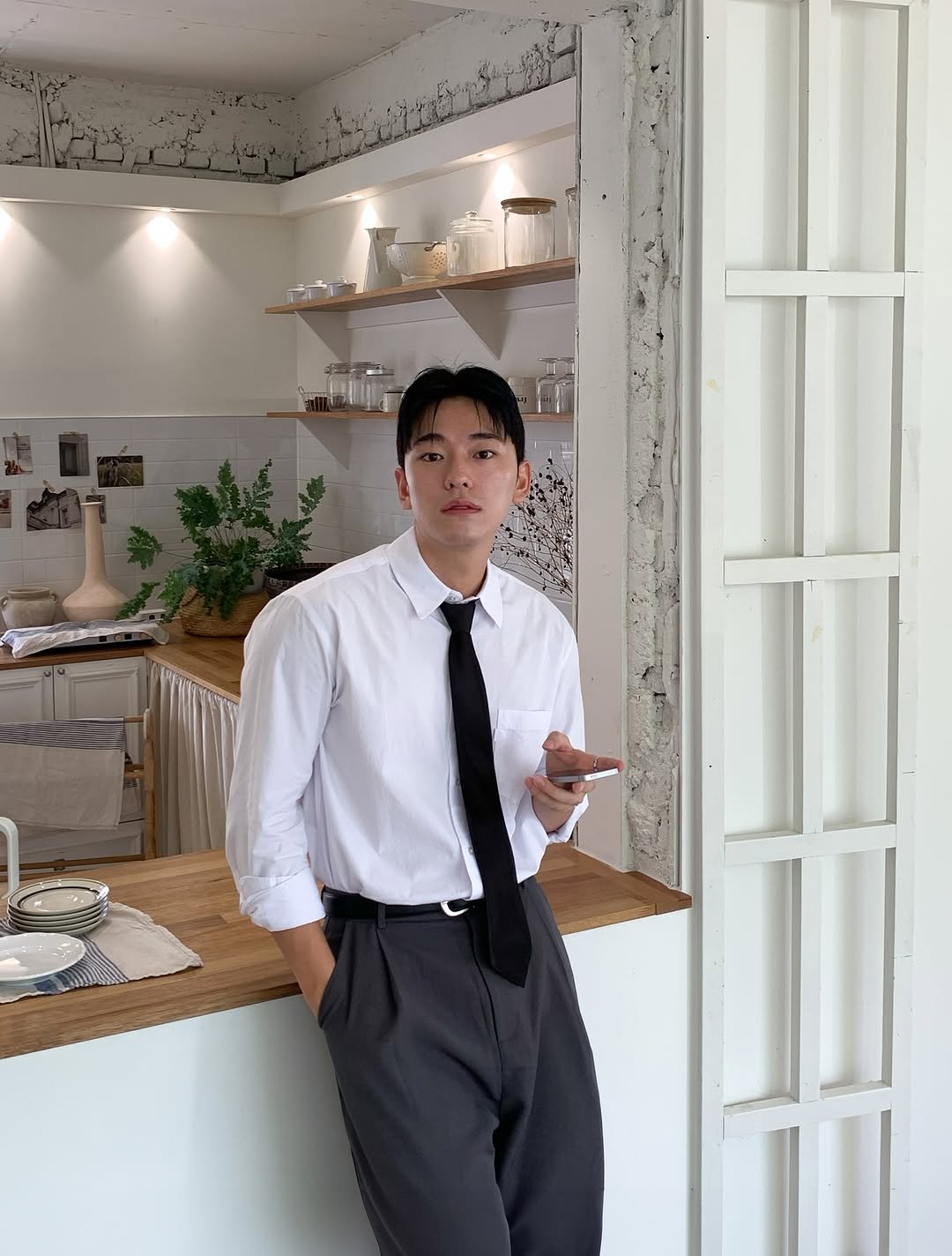 Photo by 규민_르니던 on September 01, 2025. May be an image of 1 person, bolo tie, suit, cornflower and text.