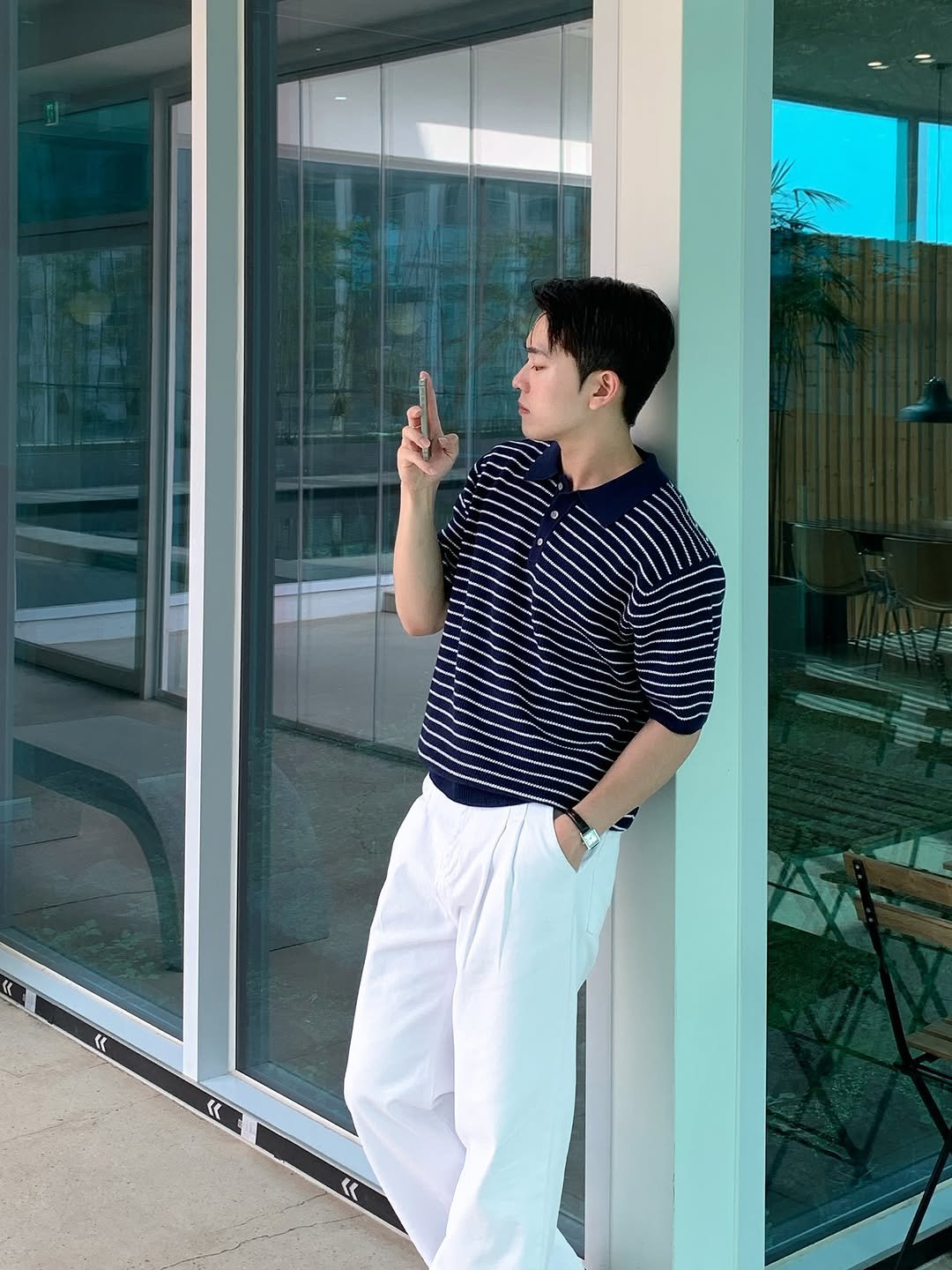 Photo by 규민_르니던 on August 12, 2025. May be an image of 1 person, standing, smoking, wingtip shoes, cigarette and text.