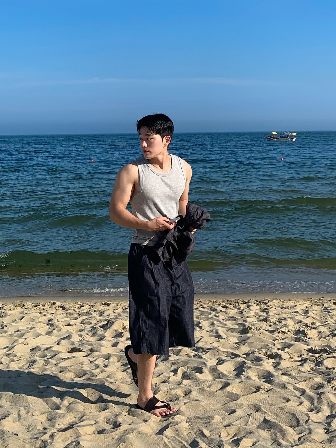 Photo by 규민_르니던 on August 10, 2025. May be an image of 1 person, beach, ocean and text.