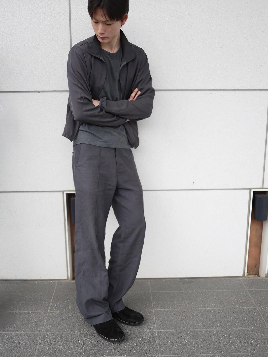 Photo by LES on October 16, 2025. May be an image of overcoat, wingtip shoes, sweatpants, suit and text.