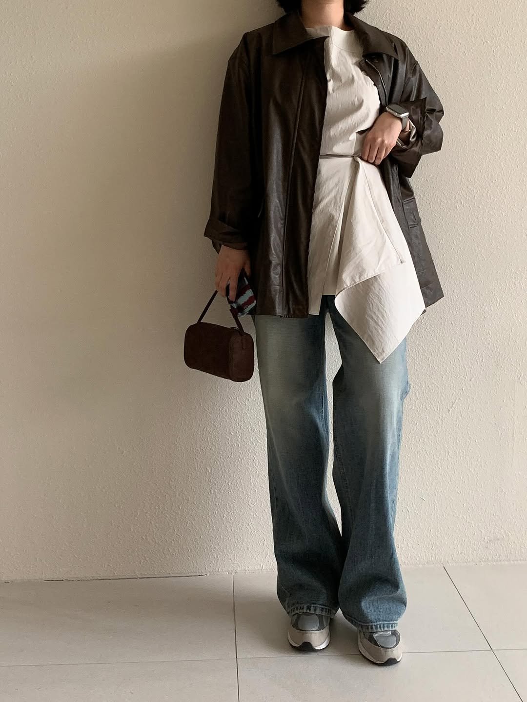 Photo by 레벨제이 on August 27, 2025. May be an image of 1 person, overcoat, jacket and text.