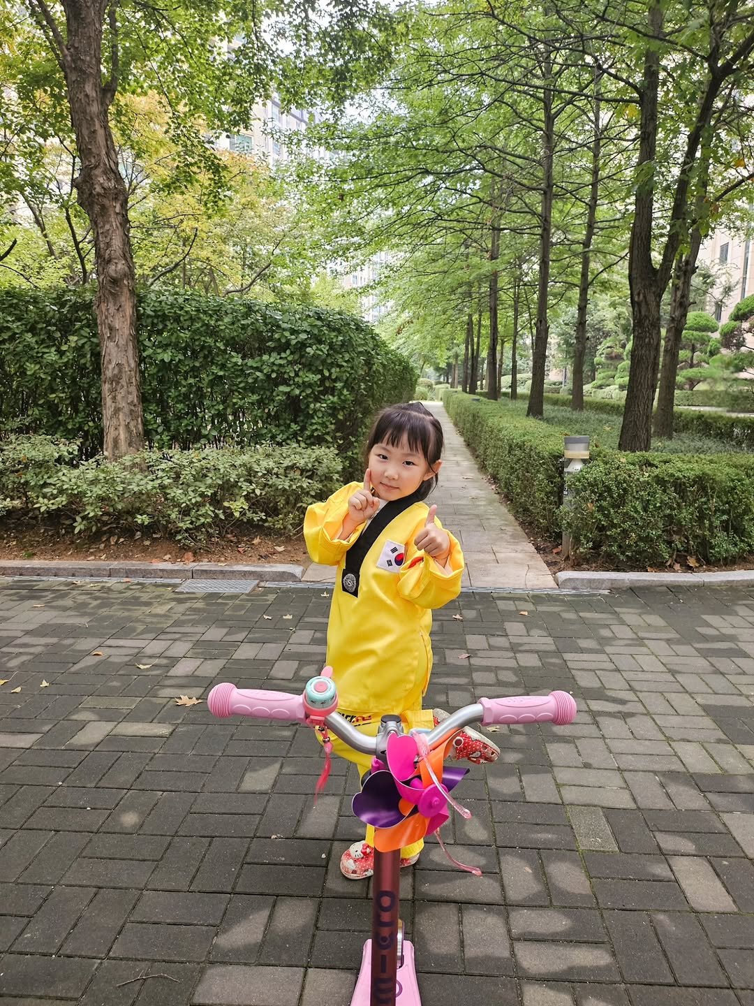 Photo by 째째맘 l 맘편한 육아ღ on September 29, 2025. May be an image of 1 person, child, scooter, bicycle, skateboard, outdoors and text.