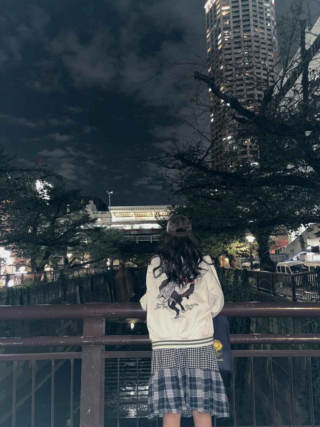 Photo by LIA on October 26, 2025. May be an image of duffle coat, Tokyo Tower, outdoors, night and text.
