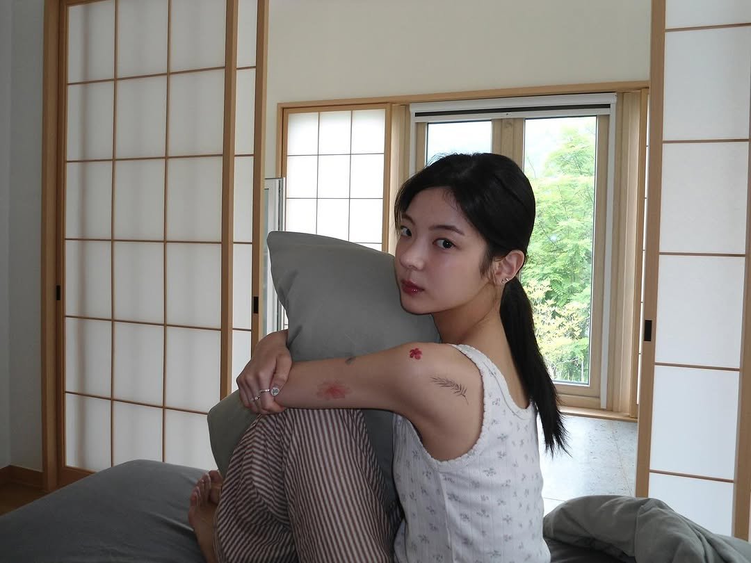 Photo by LIA on October 18, 2025. May be an image of one or more people, braids, sleepwear and text.