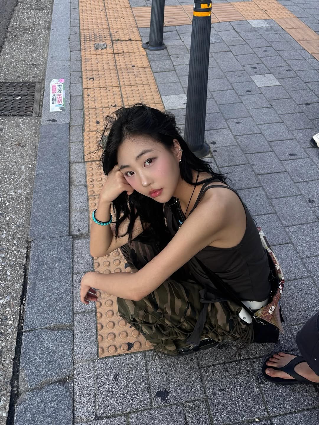 Photo by 2001🎸 on August 07, 2025. May be an image of 1 person, hair, street and text.