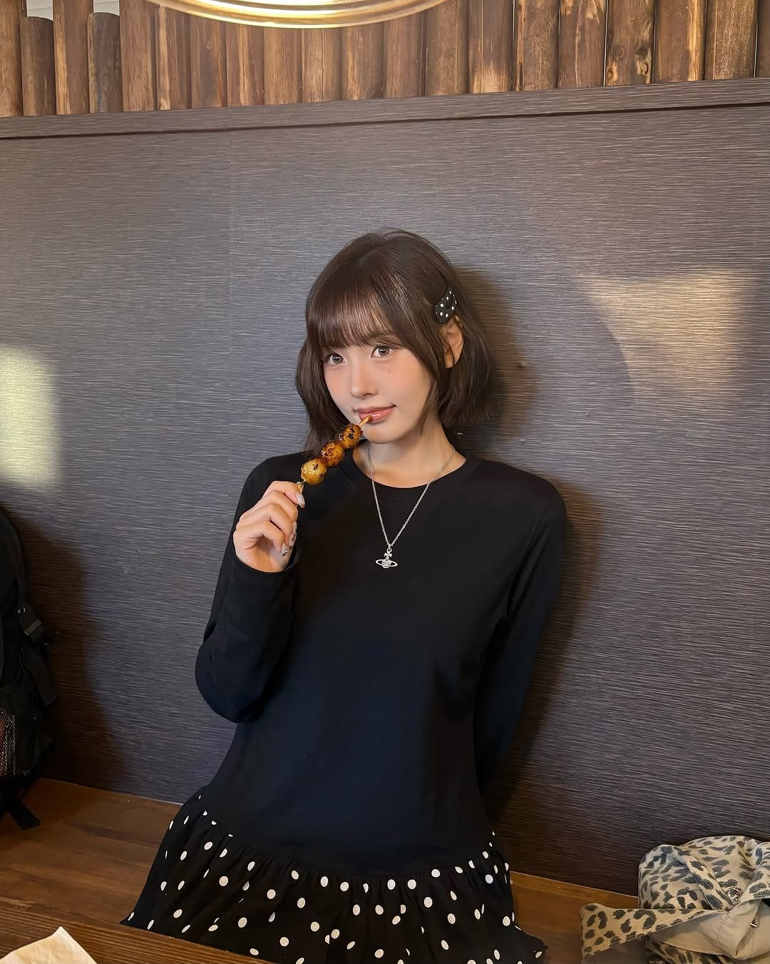 Photo shared by 리향 on October 01, 2025 tagging @ames_worldwide. May be an image of 1 person, top, dress, lollipop and text.