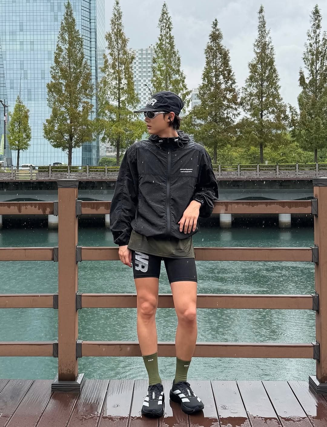 Photo shared by LIMJI / 언박싱•패션•데일리룩 on September 30, 2025 tagging @runwhither. May be an image of 1 person, raincoat, shorts, parka, sportswear and text.