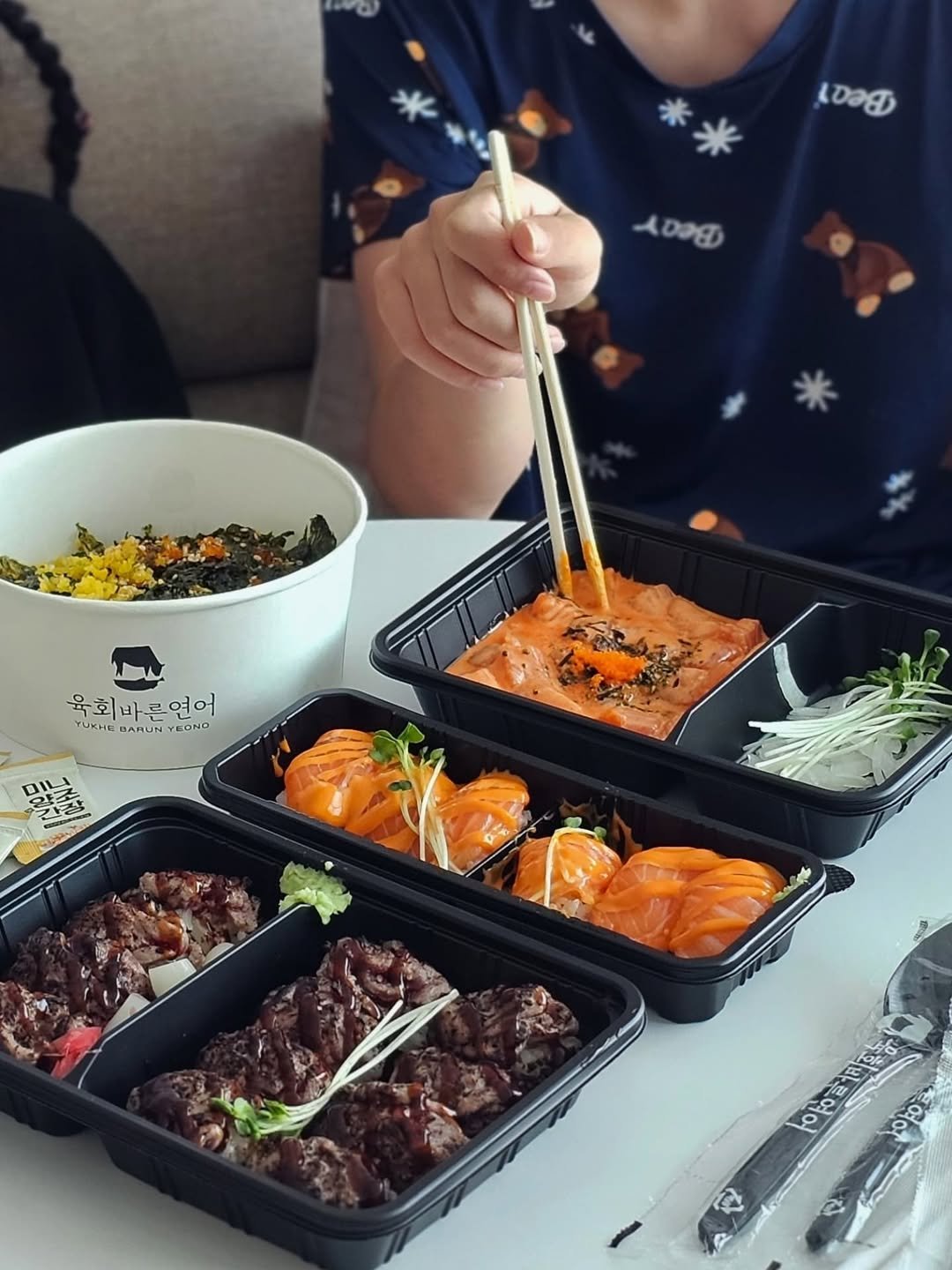 Photo shared by 원지원 on August 25, 2025 tagging @yby_official_. May be an image of 1 person, sushi, sashimi, roe, chopsticks, skewer, noodles and text.