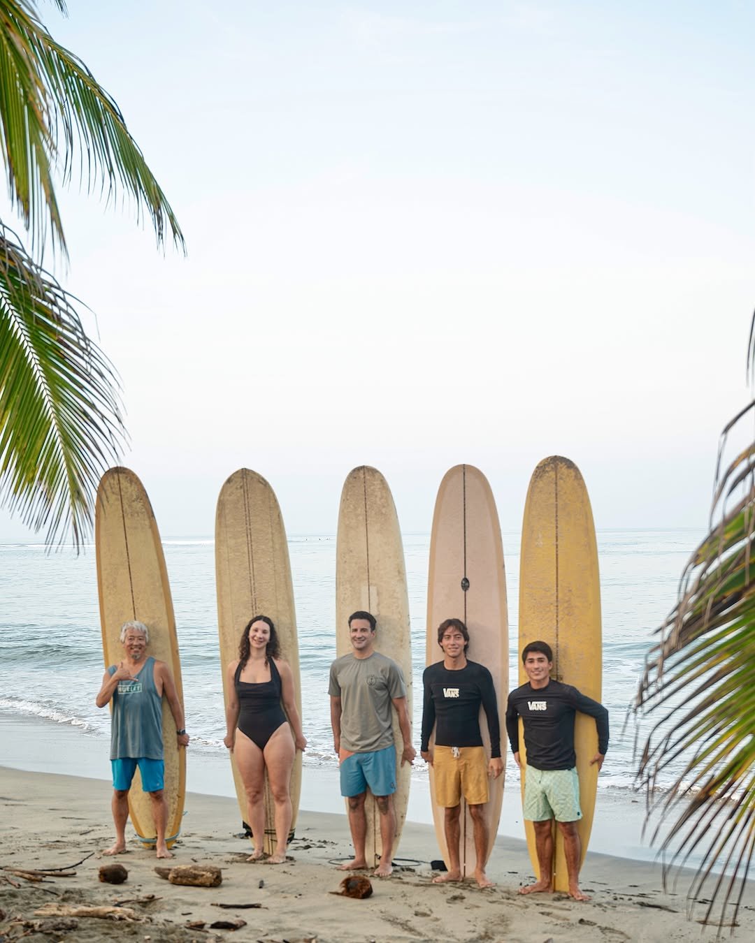 Photo shared by Longboard surf retreats on October 27, 2025 tagging @laurettak91, and @bryceroz. May be an image of surfboard, wetsuit, sarong, water, ocean, beach and text.