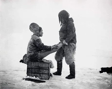 Photo by lolliesstreet on September 21, 2025. May be a black-and-white image of 2 people, child, parka, arctic and text.