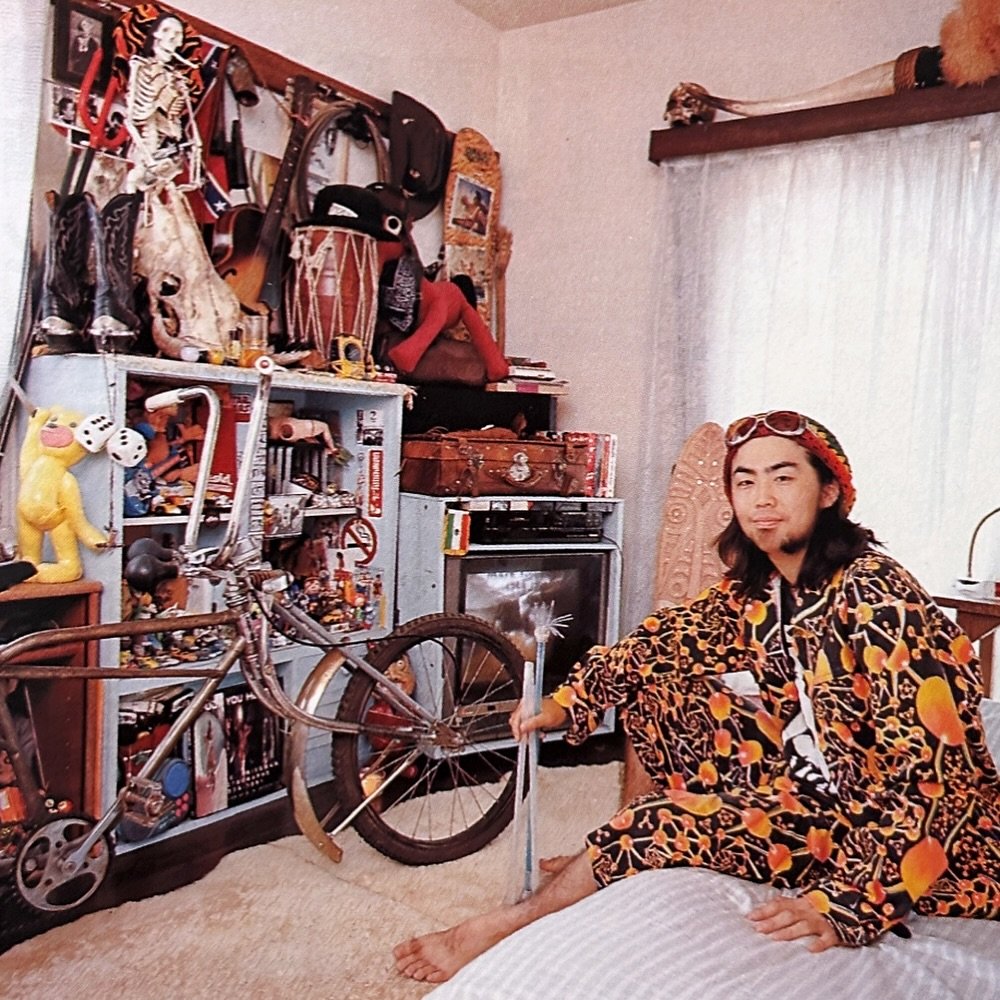 Photo shared by lolliesstreet on August 16, 2025 tagging @lolliesfashionarchives. May be an image of 1 person, bicycle, bolo tie, portable cassette player, bandanna and text.
