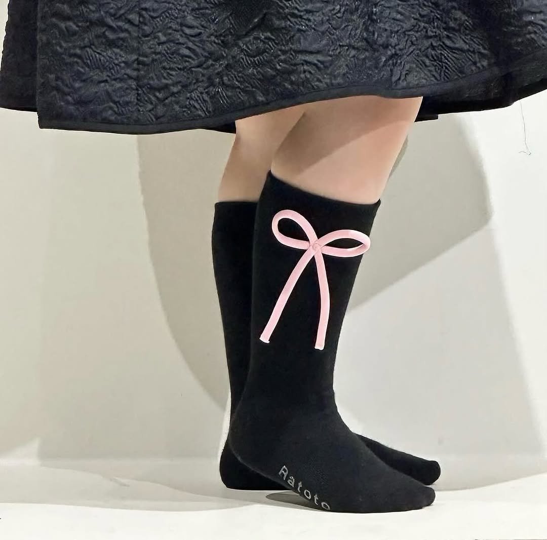 Photo by RATOTO/자체제작 on July 21, 2025. May be an image of sock, tights and text.