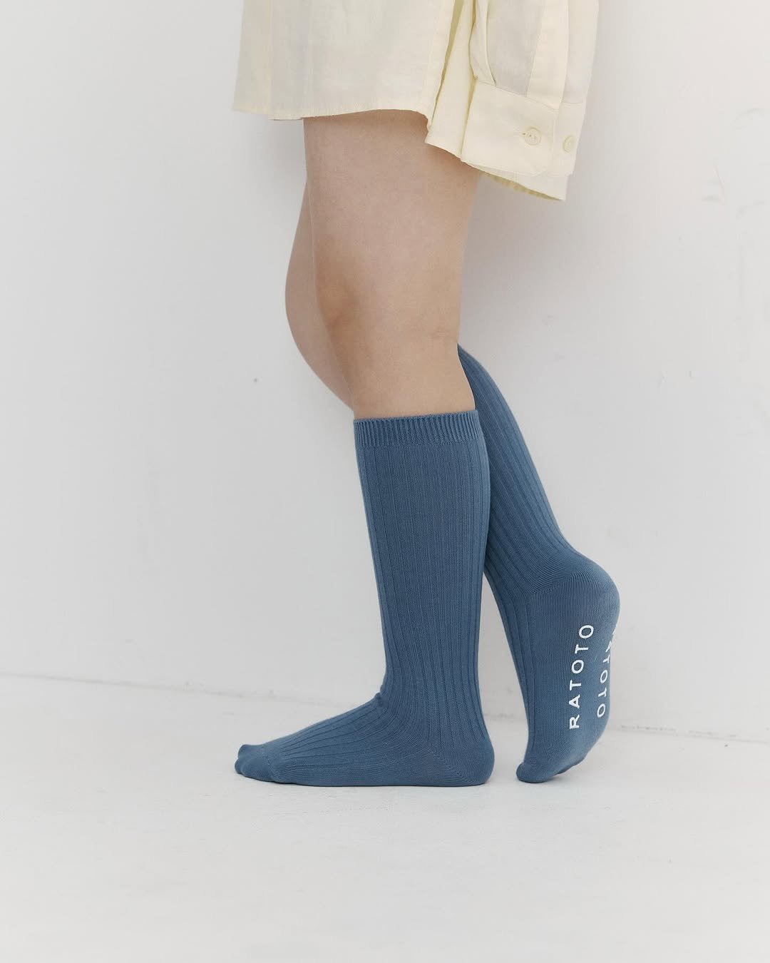 Photo by RATOTO/자체제작 on October 27, 2025. May be an image of wool, knit, tights, sock and text.