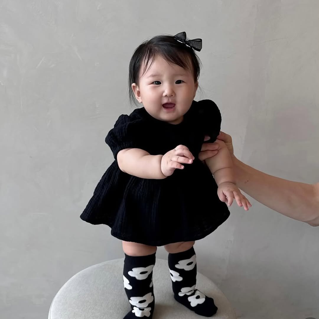 Photo by RATOTO/자체제작 on September 30, 2025. May be an image of 1 person, baby, baby shoes, tights, sock and text.