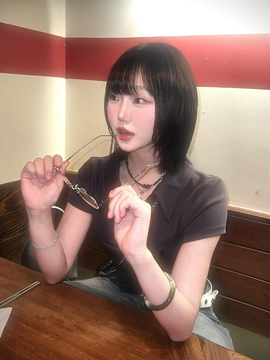 Photo by 강예빈 on July 13, 2025. May be an image of 1 person, hair, smoking, cigarette and text.