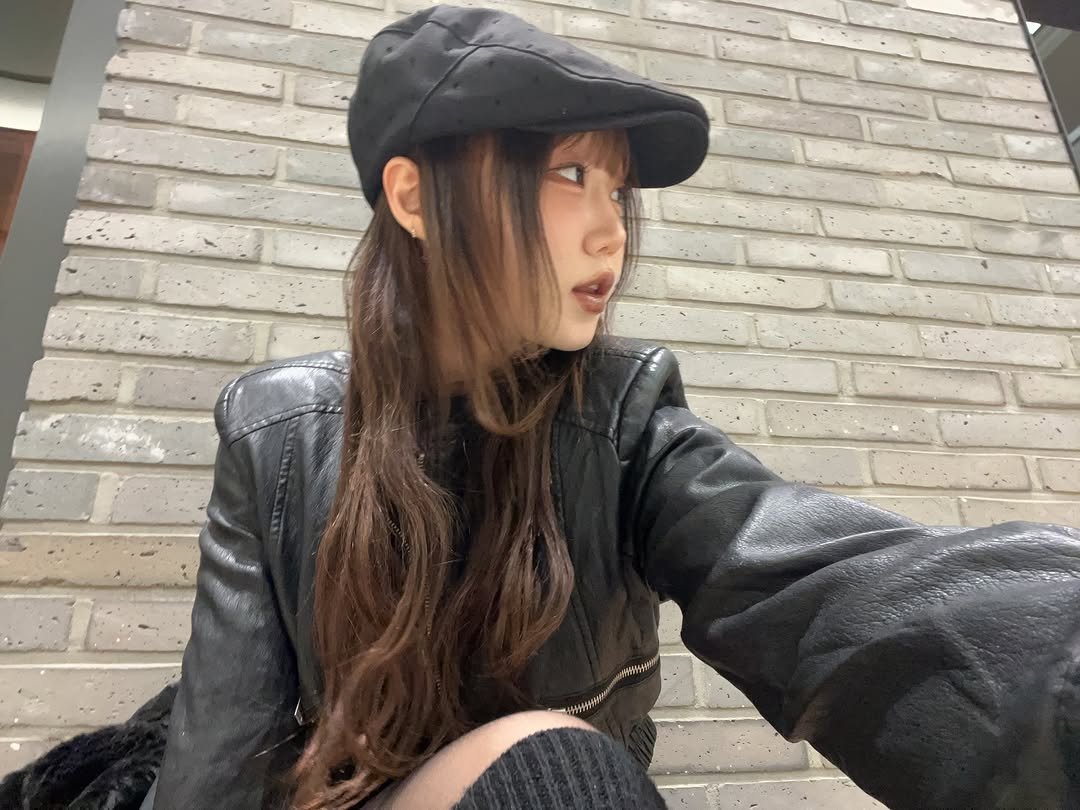 Photo by 강예빈 on February 12, 2026. May be an image of one or more people, hair, duffle coat, hat, parka, beret and text.