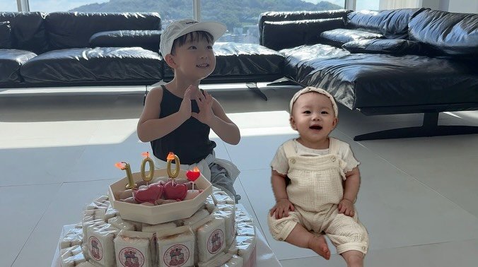 Photo by 이윤아 (태요미네) on September 22, 2025. May be an image of 2 people, baby, cake, diaper and text.