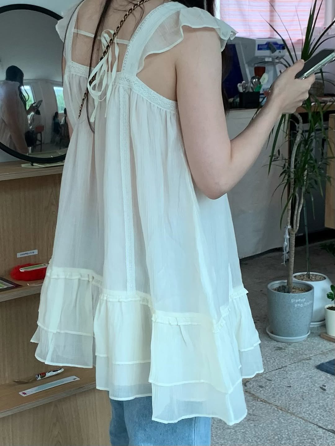Photo shared by 이윤아 on August 07, 2025 tagging @thebarnnet. May be an image of 1 person, slip, sundress and text.