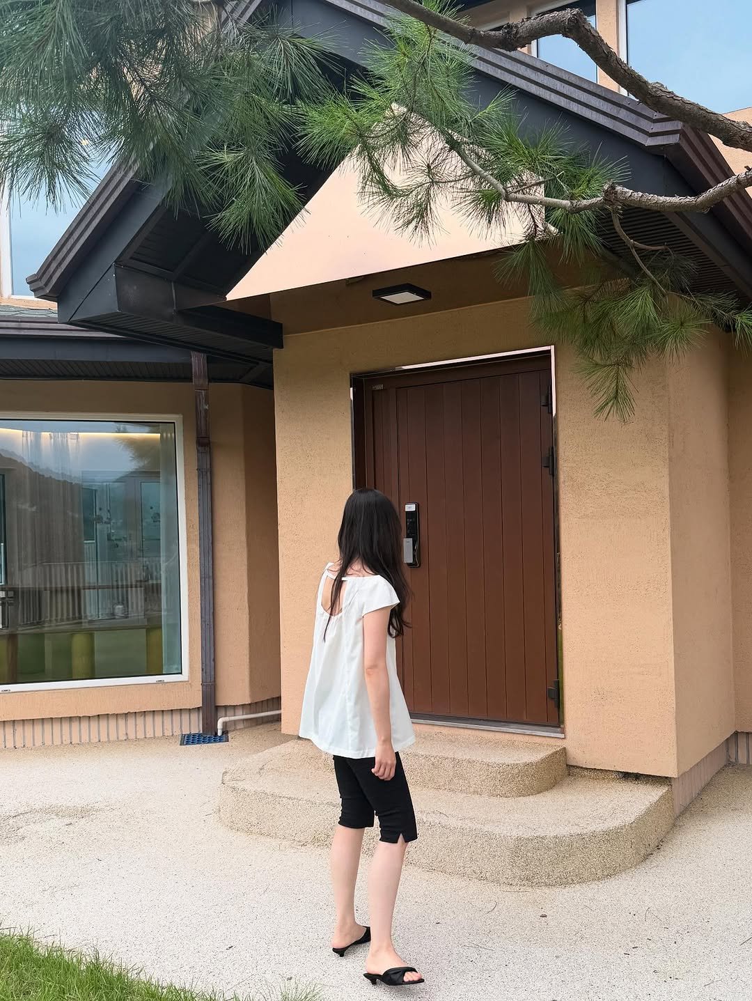 Photo shared by 이윤아 on August 11, 2025 tagging @ore_clothing, and @nokseop_official. May be an image of 1 person, outdoors and text.