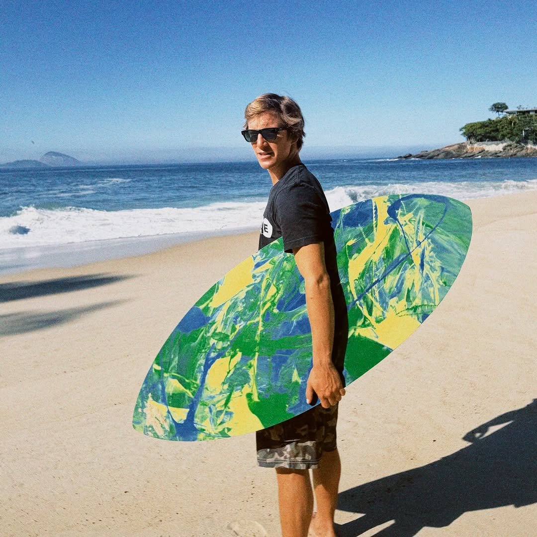 Photo shared by Lucas Fink on April 24, 2026 tagging @hbbrasil, and @exileskimboards. May be an image of surfboard, skateboard, wetsuit, water and text.