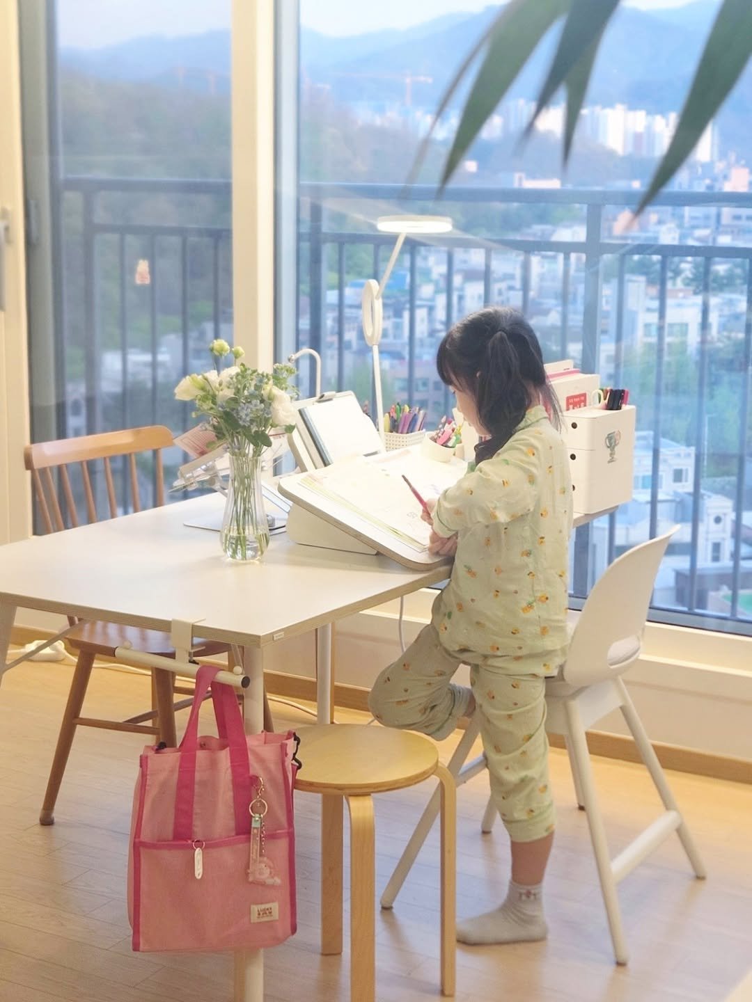 Photo by 루미하루 on February 07, 2026. May be an image of studying, sleepwear, clothes iron, desk, cornflower and text.