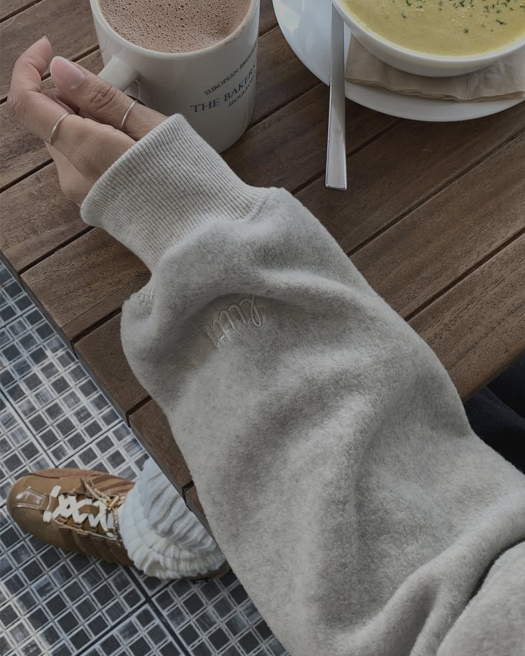 Photo by LUTH on September 17, 2025. May be an image of coffee cup, duffle coat, coffee, parka, tea, cappuccino and text.