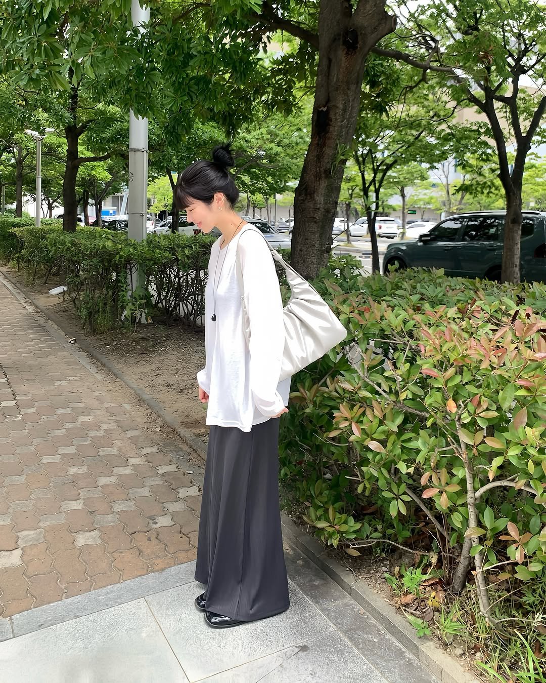 Photo by @제영 on July 14, 2025. May be an image of 1 person, suit, outdoors and text.