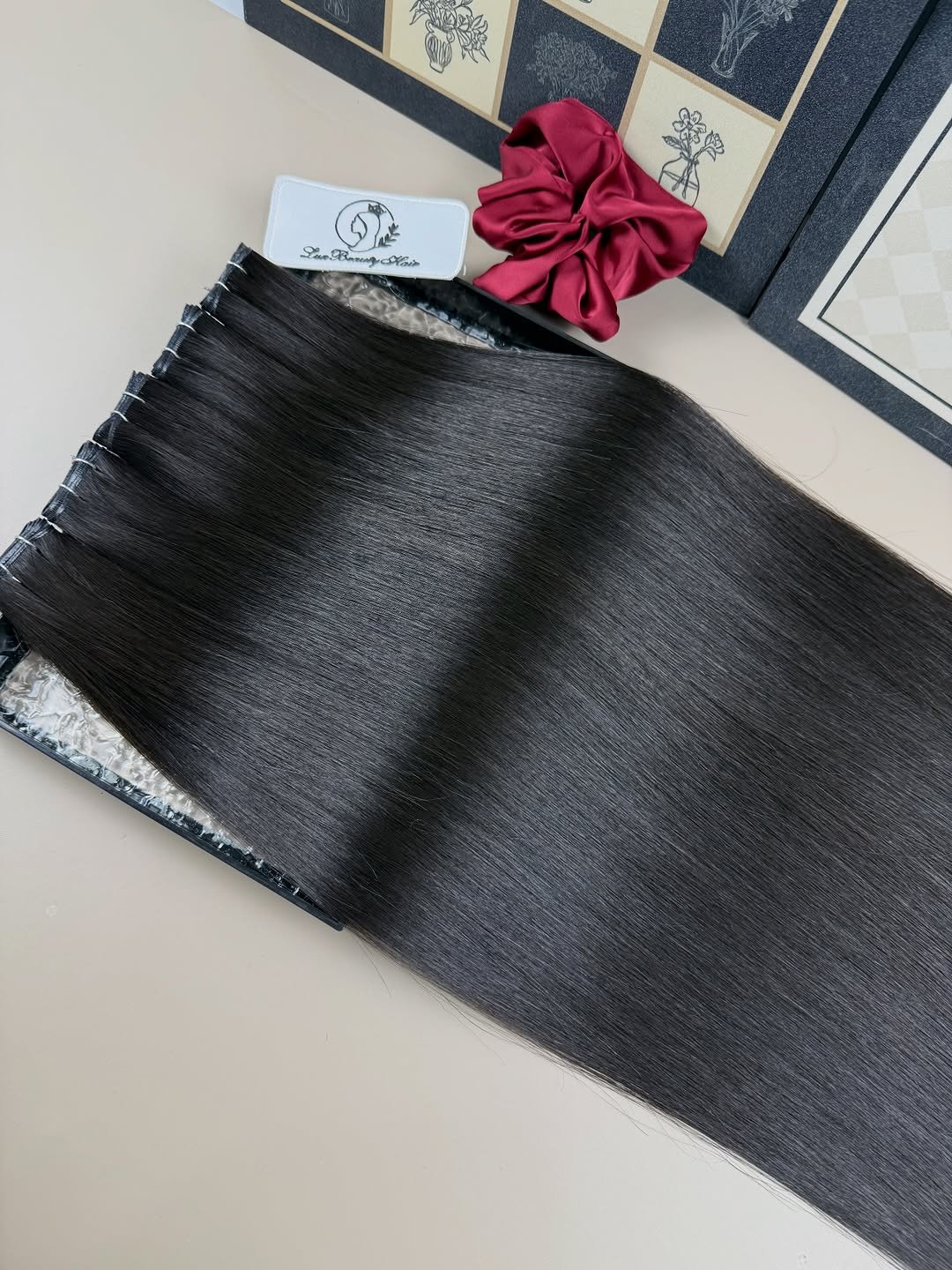 Photo by Hair manufacturer|Kertain| Wefts| Tapeins|Halo hair| Toppers| on March 26, 2026. May be an image of wool, carpet and text.