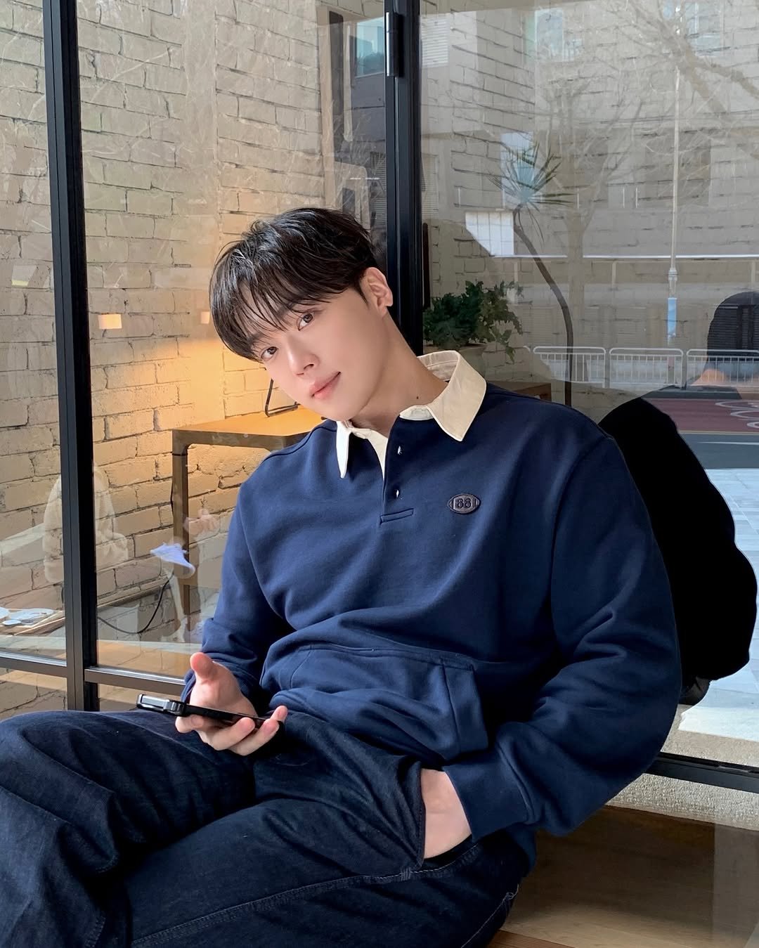 Photo shared by 지 훈 on March 24, 2026 tagging @notonlyfortoday_official. May be an image of duffle coat, sweatpants, turtleneck and text.