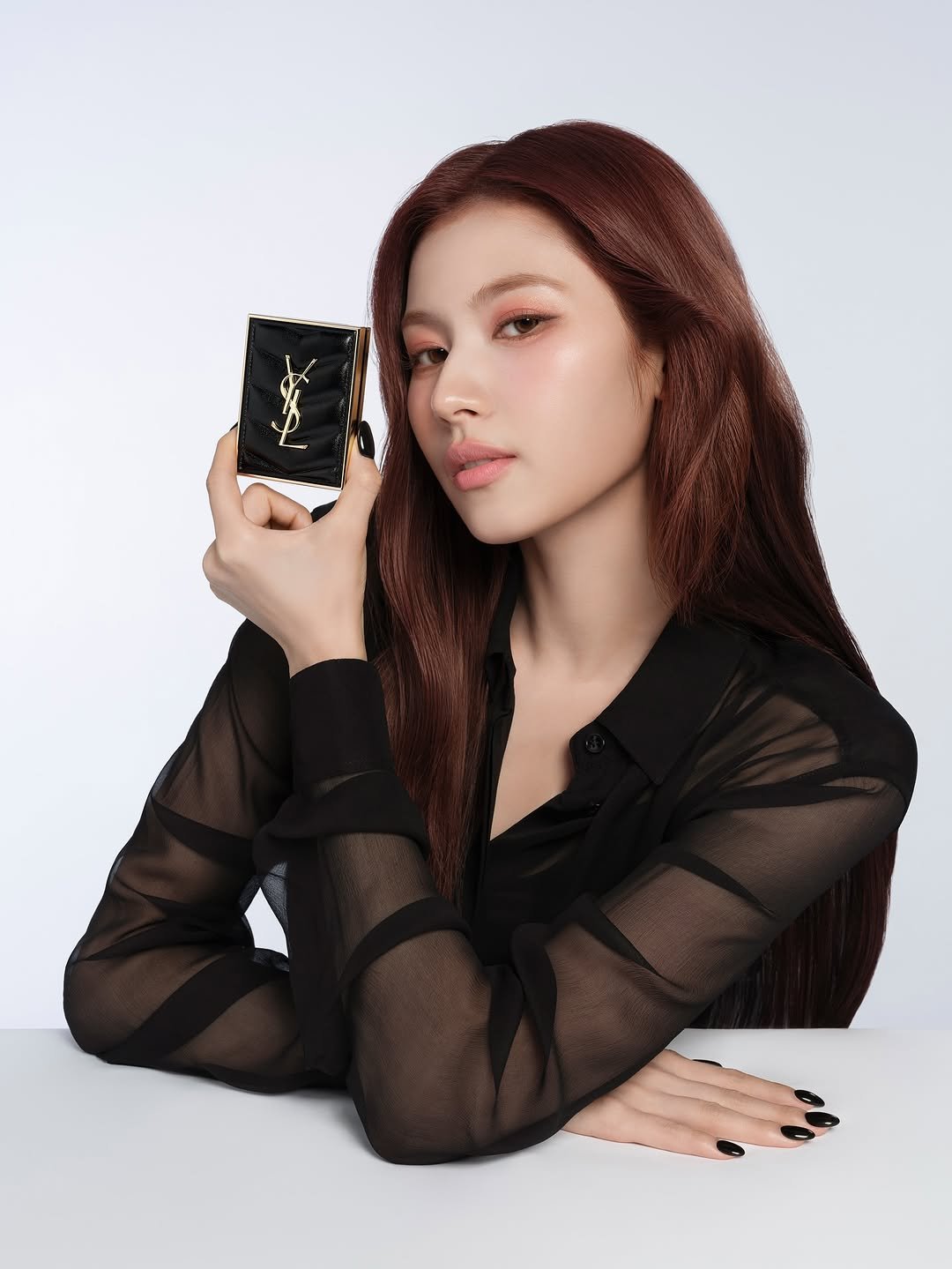 Photo shared by 사나 𝚂𝚊𝚗𝚊 on August 07, 2025 tagging @yslbeauty. May be an image of 1 person, makeup, hair, phone, bar soap and text.