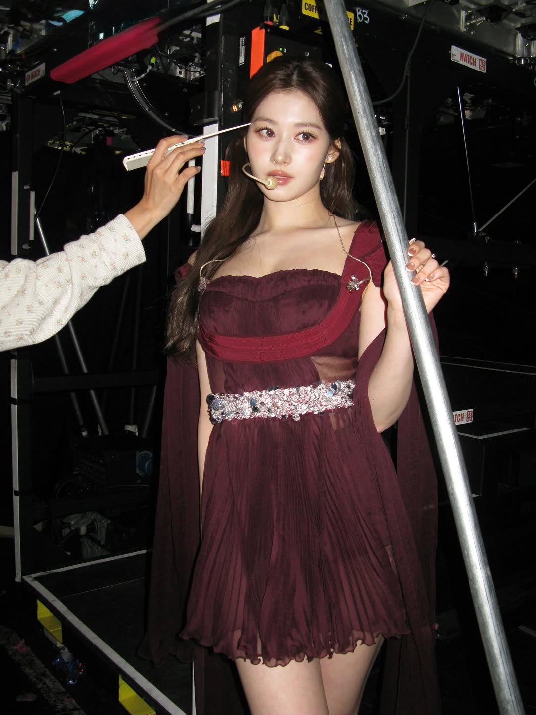 Photo shared by 사나 𝚂𝚊𝚗𝚊 on March 08, 2026 tagging @prada. May be an image of one or more people, hair and text.